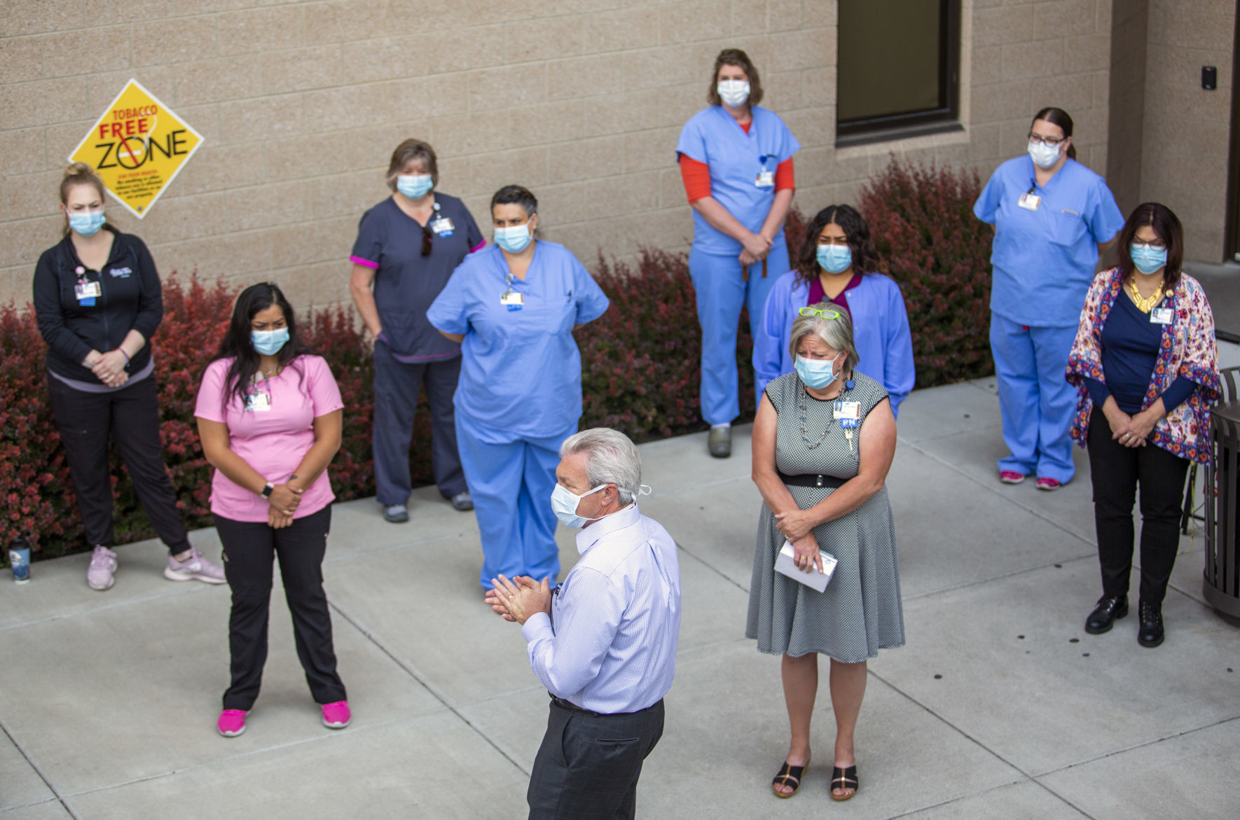 Hospital staff show solidarity with moment of silence
